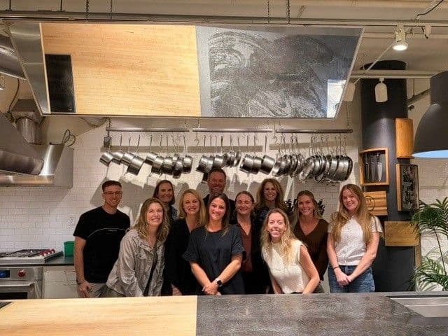 The Marketri team gathered together in a kitchen during the annual retreat in Minneapolis