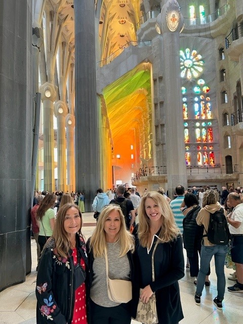 Deb Andrews of Marketri and two friends smiling in La Sagrada Familia